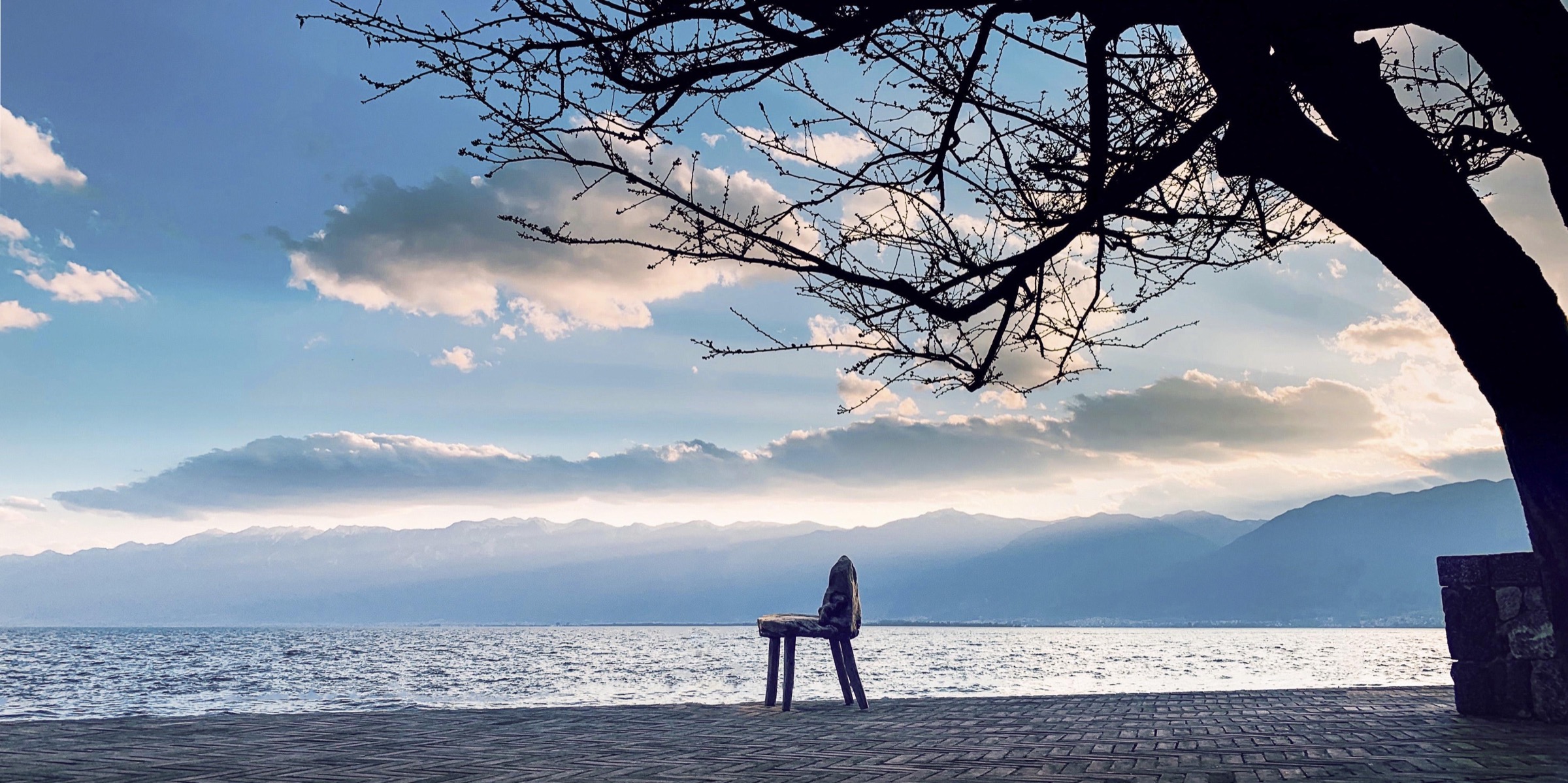 The lakeside terrace at Dream Island Erhai facing Cangshan